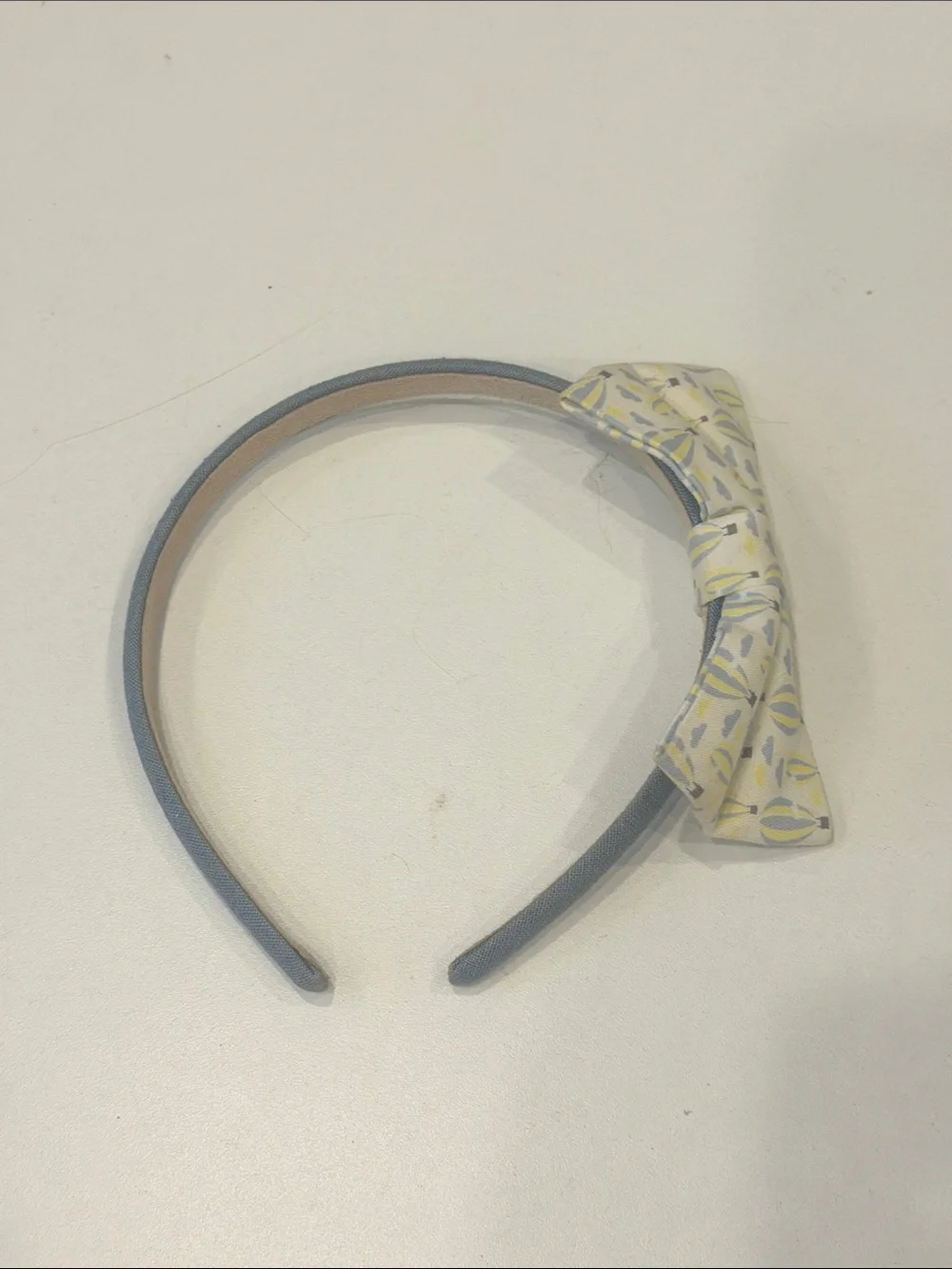 Blue Fabric Headband with Patterned Yellow Bow Accent